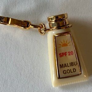 Juicy Malibu Sunscreen "Surf Dive and Ski" charm